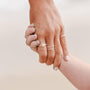 handmade studio handcrafted jewelry hand showing assortment of rings
