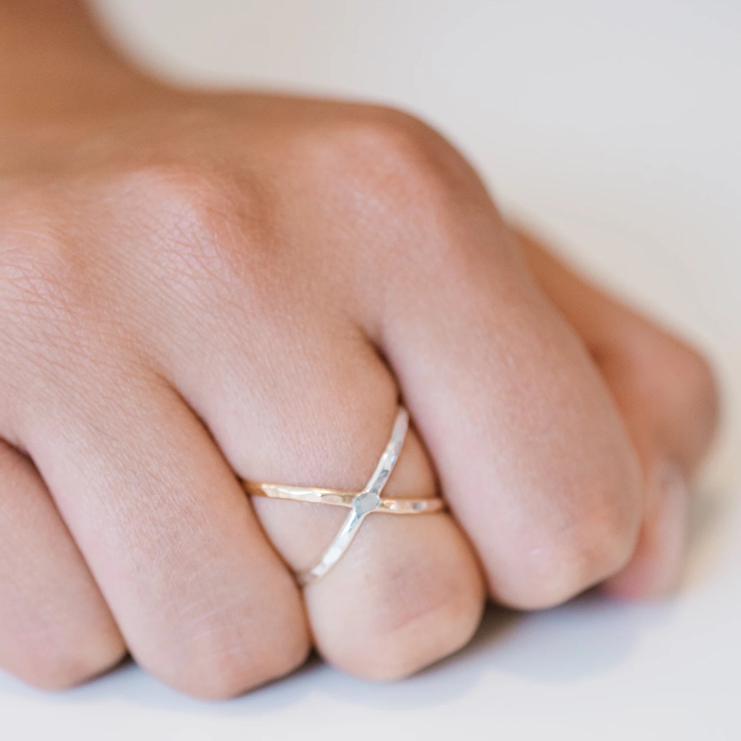 Criss cross shop orbit ring